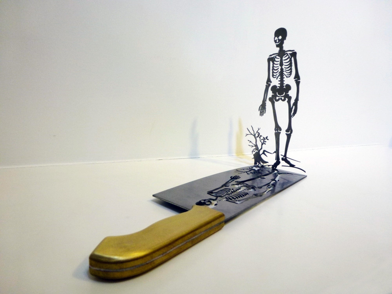 Illustration for article titled Intricate shadow silhouettes carved out of butcher's knife blades